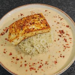 A picture of Peri Peri Paneer Steak Bowl served with Herbed Rice and Peri Peri Sauce.