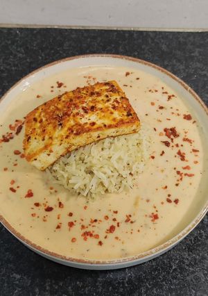 A picture of Peri Peri Paneer Steak Bowl served with Herbed Rice and Peri Peri Sauce.
