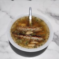 A picture of Sausages and butterbean Broth.