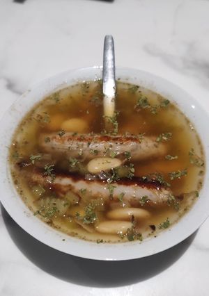 A picture of Sausages and butterbean Broth.