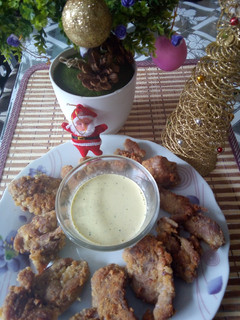 Una foto de Nuggets de pavita con salsa de huacatay