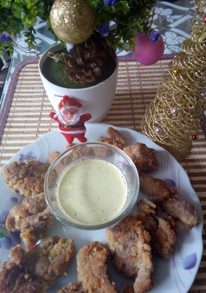 Una foto de Nuggets de pavita con salsa de huacatay