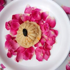A picture of Tender coconut (Malai) and rose dessert.