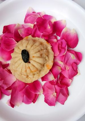 A picture of Tender coconut (Malai) and rose dessert.