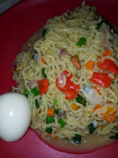 A picture of Vegetable noodles with boiled egg.