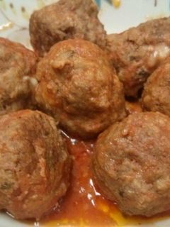 A picture of Mozzarella stuffed meatballs in slow cooker.