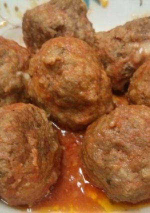 A picture of Mozzarella stuffed meatballs in slow cooker.