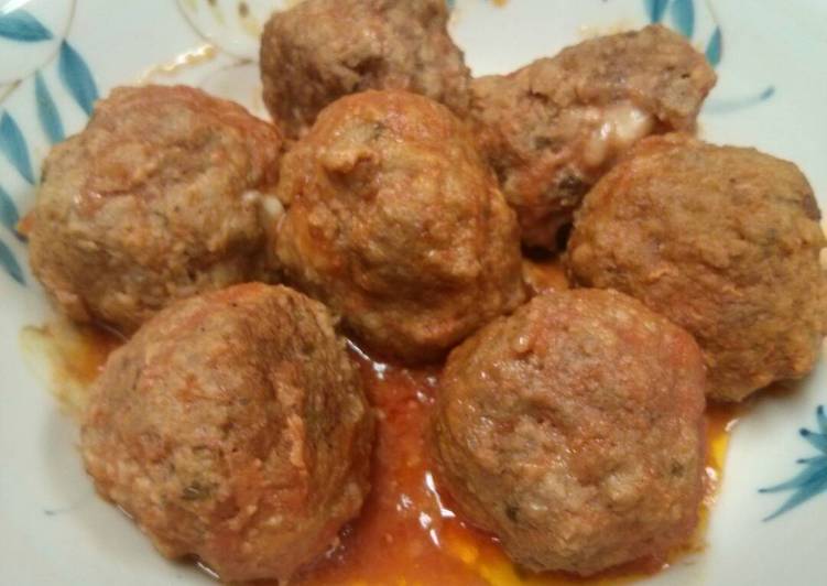Mozzarella stuffed meatballs in slow cooker