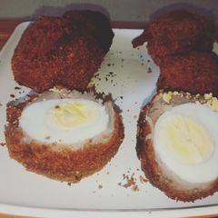 A picture of Potatoes scotched eggs.