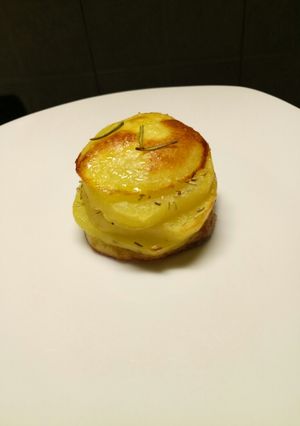 A picture of Potato and rosemary stack.
