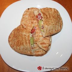 A picture of Greek salad sandwich in Cypriot pita bread.