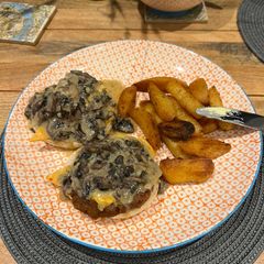Open Burgers with mushroom sauce & fries A picture of Open Burgers with mushroom sauce & fries.
