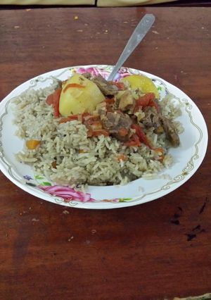A picture of Rice masala with Potato & Beef stew.