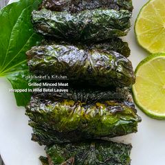 A picture of Grilled Minced Meat Wrapped in Wild Betel Leaves (Bò Lá Lôt).
