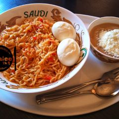 A picture of Indomie with boiled eggs.