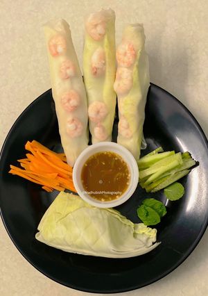 A picture of Vietnamese style Shrimp Roll with red chilli sauce.