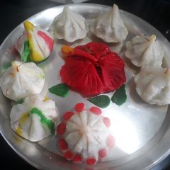 A picture of Hibiscus shape Steamed modak.