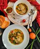 Orange flavour sweet & sour soup with besan ravioli