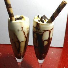 A picture of Chocolate shake scoop with vanilla ice cream.