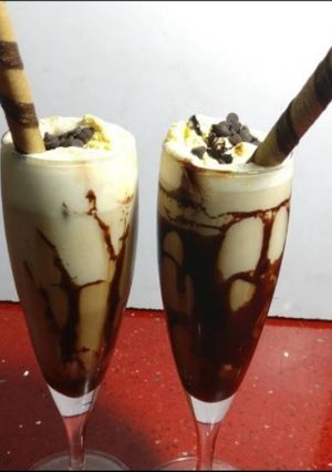 A picture of Chocolate shake scoop with vanilla ice cream.