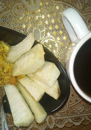 A picture of Fried yam wit scrambled egg/ black tea.