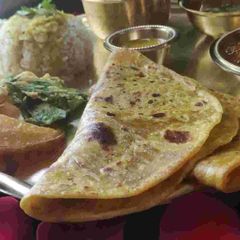 A picture of Holi Special Wheat Flour Puran Poli And Katachi Amti.