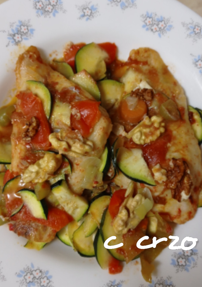 Una foto de Pescado con calabacín y nueces