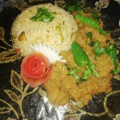 A picture of Turnip Masala with Vegetable rice.