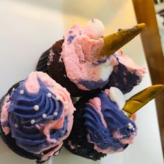 A picture of Colourful mini myni moo cup cakes uni corn.