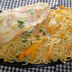A picture of Fried eggs with stir fry noodles.