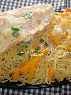 A picture of Fried eggs with stir fry noodles.