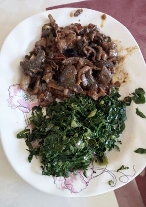 A picture of Matumbo stewed with greens.