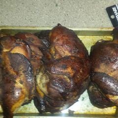 A picture of Pecan smoked jerk chicken.