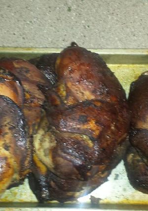 A picture of Pecan smoked jerk chicken.