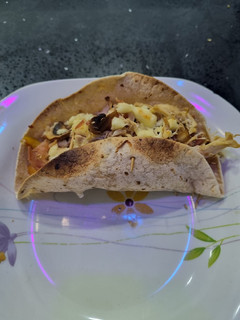 Una foto de Taquitos de pollo y tocino