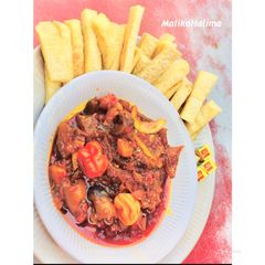 A picture of Fried yam and kpamo stew.