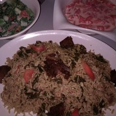 A picture of Jallof rice and cos low with water melon.