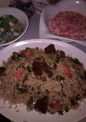 A picture of Jallof rice and cos low with water melon.
