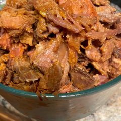 A picture of Pulled pork (slow cooker/oven) cooking with root beer.