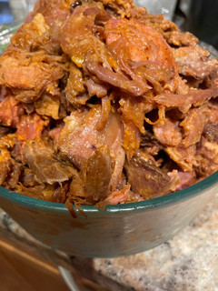 A picture of Pulled pork (slow cooker/oven) cooking with root beer.