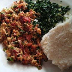 A picture of Kales/fried eggs and ugali.