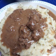A picture of Riced Potatoes and Meatball Gravy.