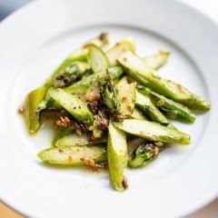 A picture of Sauteed asparagus with anchovies.