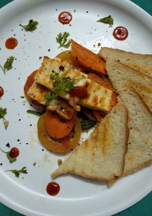 A picture of Grilled vegetables with spinach and Toast.