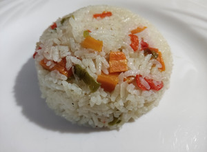 Una foto de Arroz con caldo de pollo