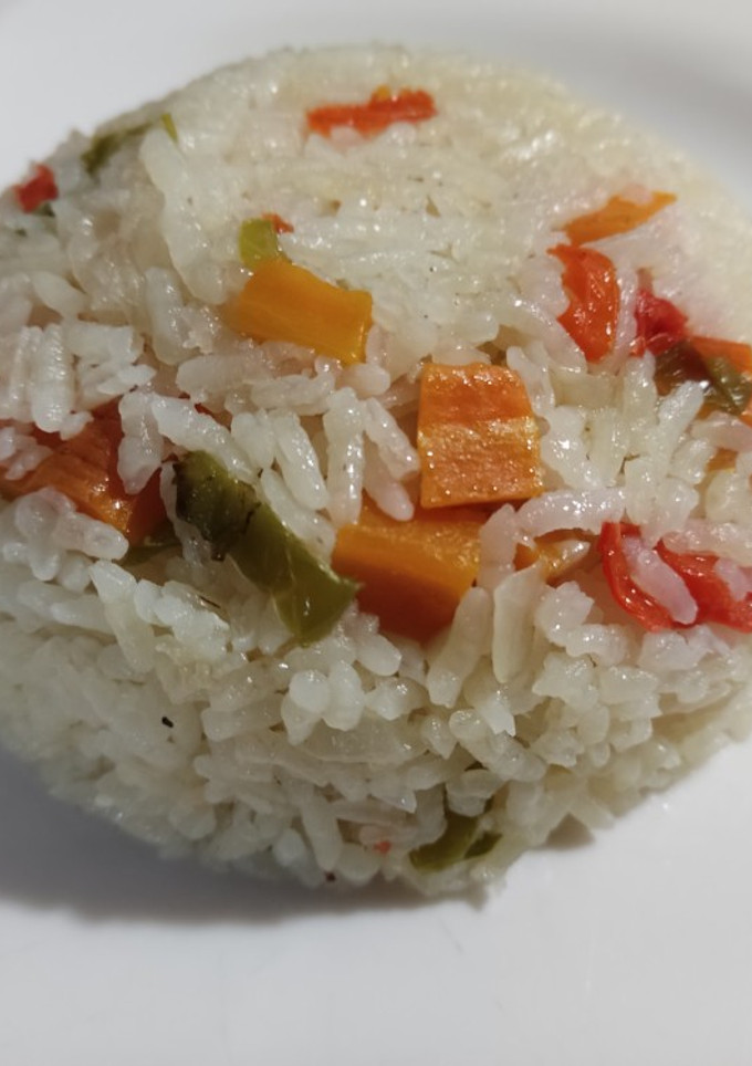 Una foto de Arroz con caldo de pollo