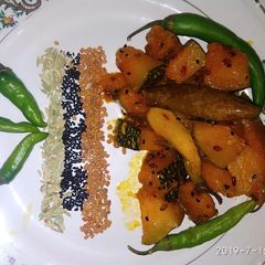 A picture of Pumpkin and raw mango sabji.