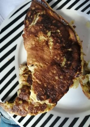 Una foto de Homelette de salteado de panceta, cebolla y ajo