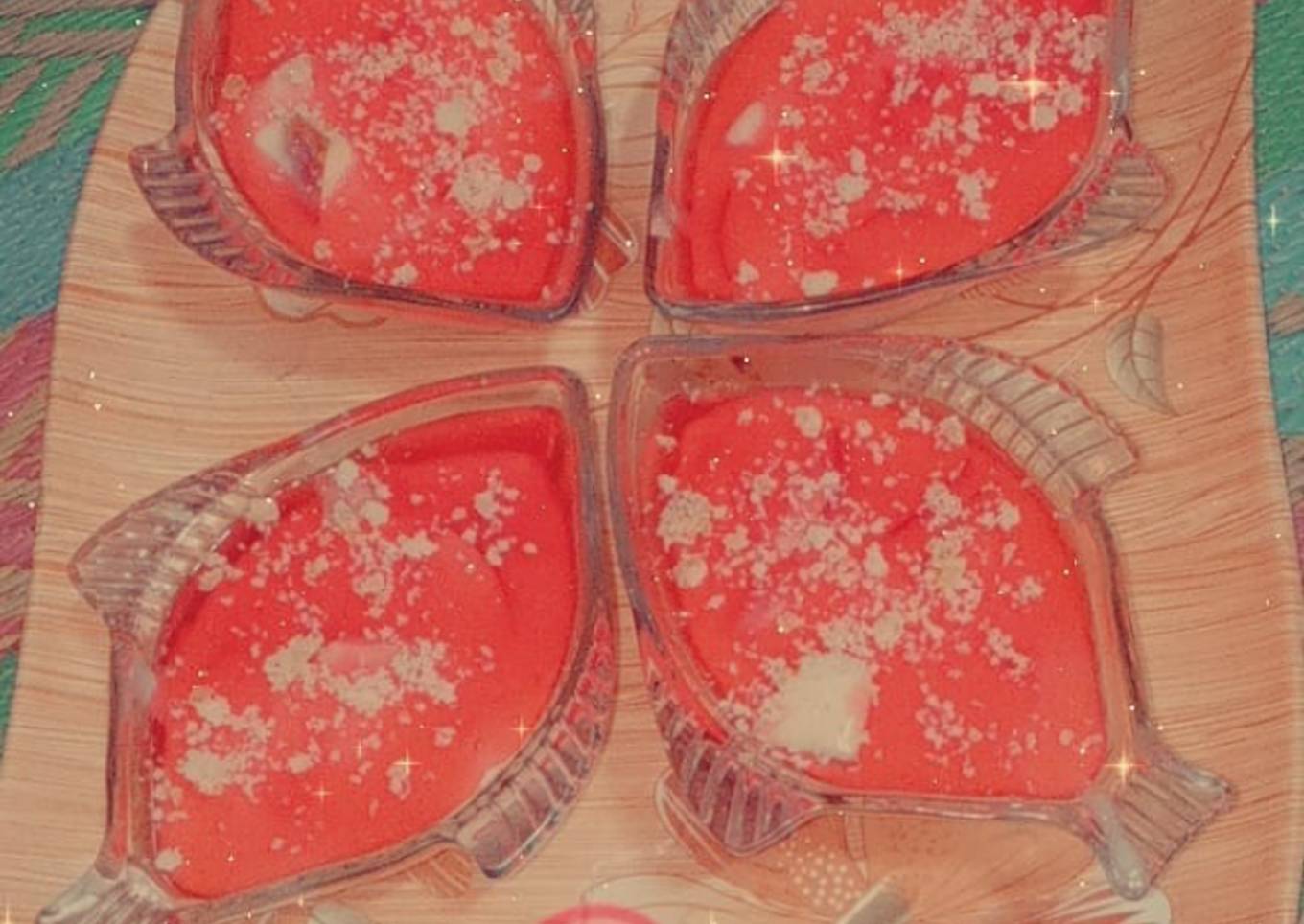 Jelly with strawberry chunks and almond topping