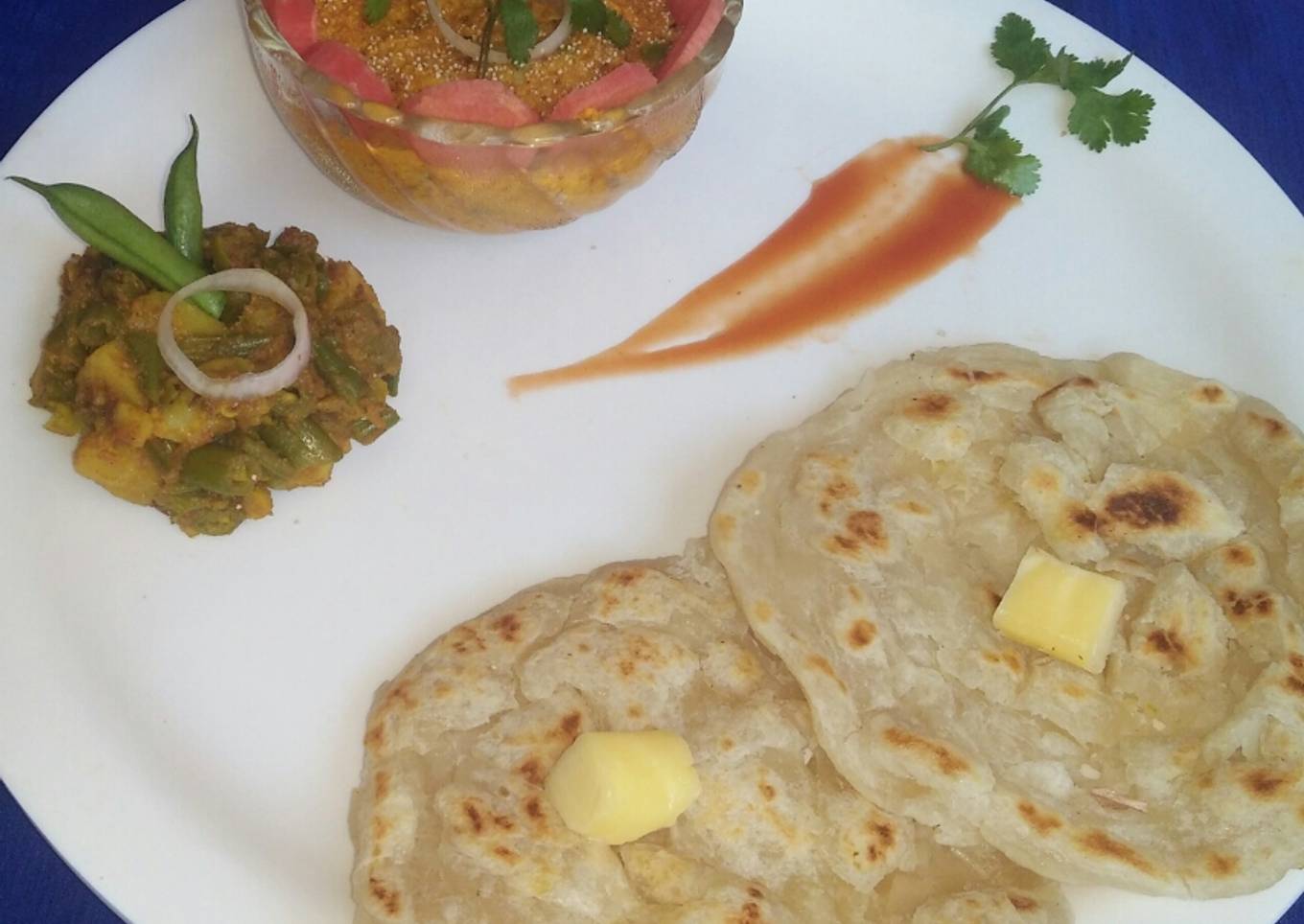 Navratna korma,potato beans veg with layered paratha